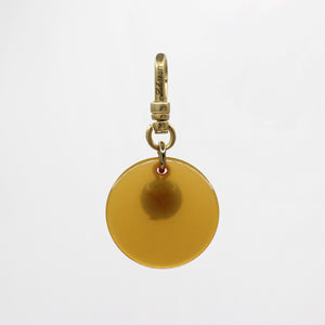 Sun & Moon Saffron Translucent Bakelite with Turquoise Glass Bead Dua Charm