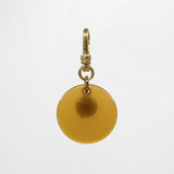 Sun & Moon Saffron Translucent Bakelite with Turquoise Glass Bead Dua Charm