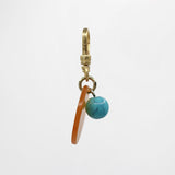 Sun & Moon Saffron Translucent Bakelite with Turquoise Glass Bead Dua Charm
