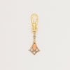 Articulated geometric charm with coral cabochon